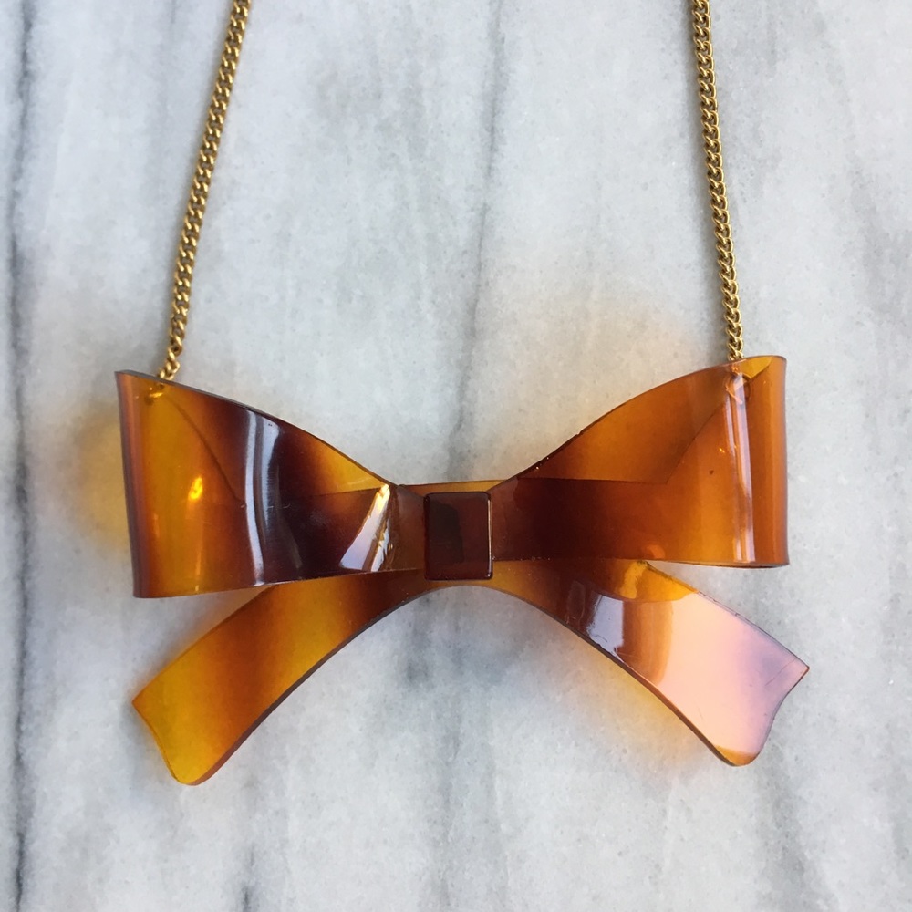 Yochi Tortoise Plastic Bow Necklace.